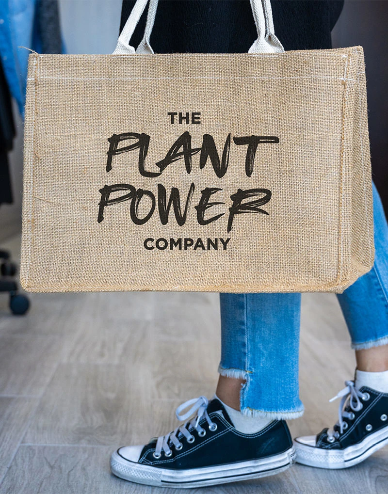 A carrier bag branded by The Plant Power Company